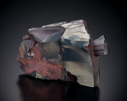 A piece of mineral with a dark background