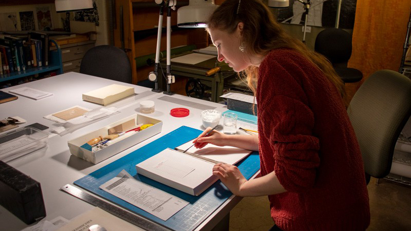 Collecting and preserving books are two ways to create resources for future generations to look back on. In addition to her collecting efforts, Miriam-Helene Rudd helps preserve and repair books as a student assistant in Morris Library.