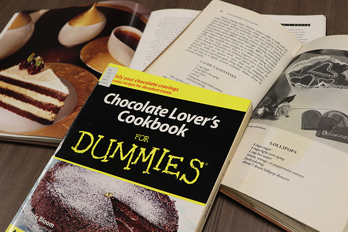 Chocolate-making books arranged on a table