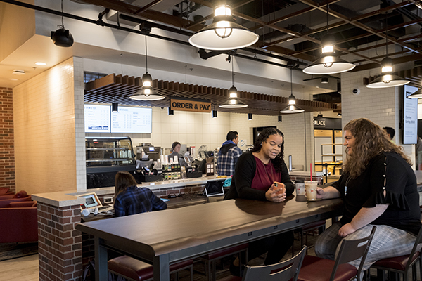 Students eat and socialize inside The Nest eatery.