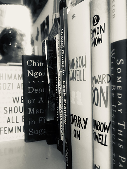 A black and white image of book spines.