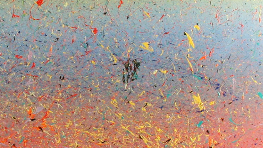 Detail from an abstract painting showing colorful splatters of paint.