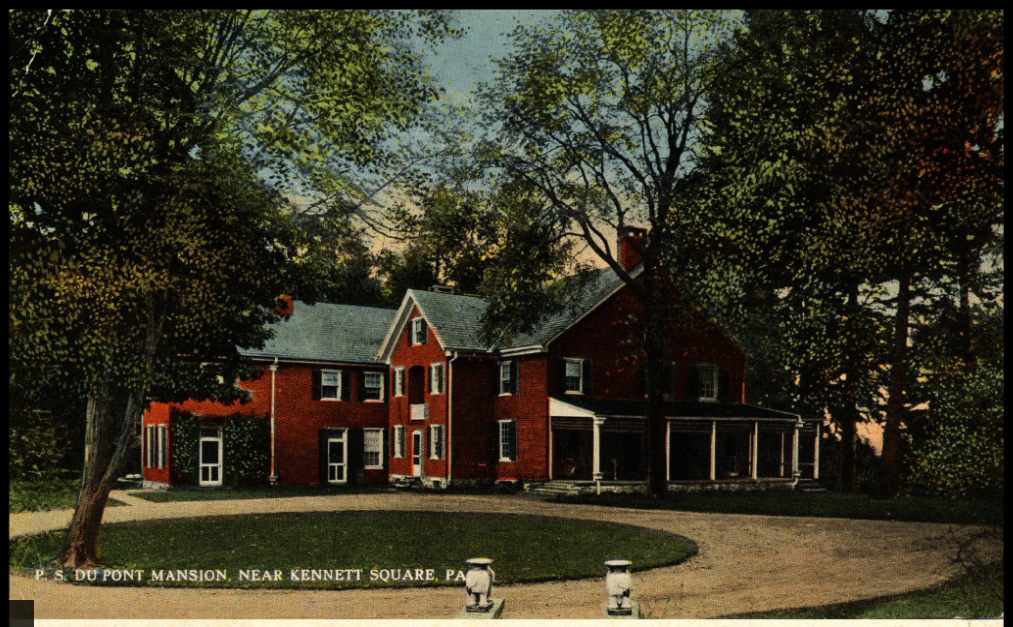 A postcard showing a red mansion