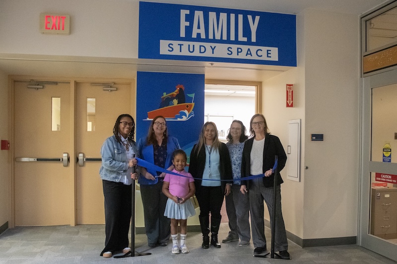 Various attendees are pictured at the ribbon cutting for the Family Study Space on Tuesday, April 28.