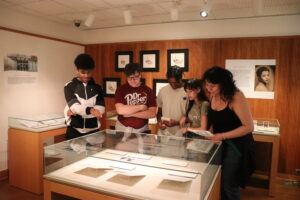Group of visitors viewing an exhibition in the Special Collections Gallery