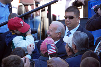 Photograph of U.S. Sen. Joseph R. Biden, Jr., greeting a young Phillies fan at presidential campaign rally on UD campus, October 31, 2008. Image L. Rebecca Johnson Melvin.